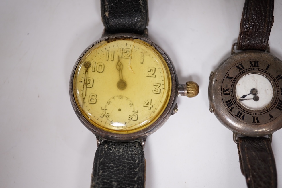 An early 20th century silver Borgel cased manual wind wrist watch(a.f.), one other similar silver half hunter manual wind wrist watch(no strap) and one other similar with a strap. Condition - poor
